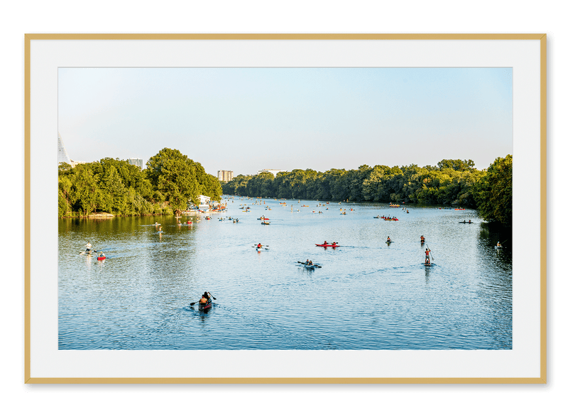 Kayakers and paddleboarders on Lady Bird Lake