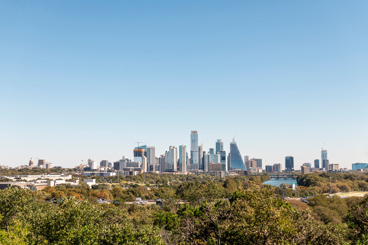 A western view of the Austin skyline under a clear blue sky
