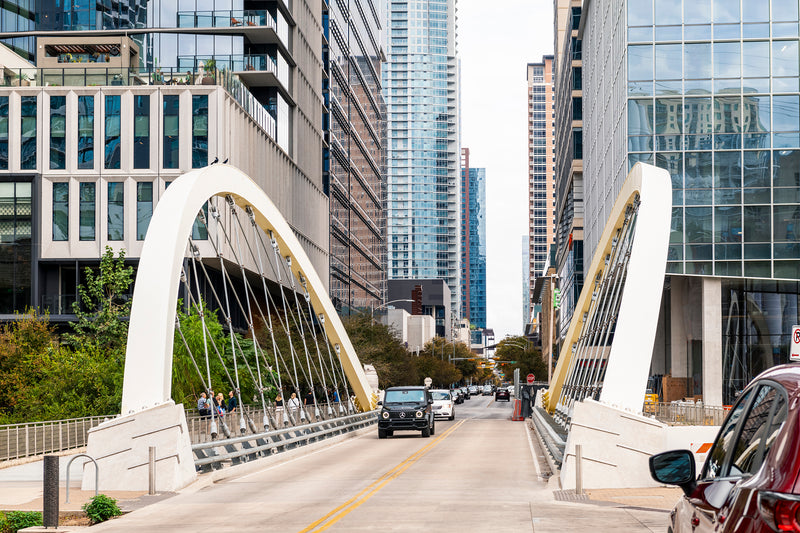 A car drives across Butterfly Bridge in downtown Austin, TX