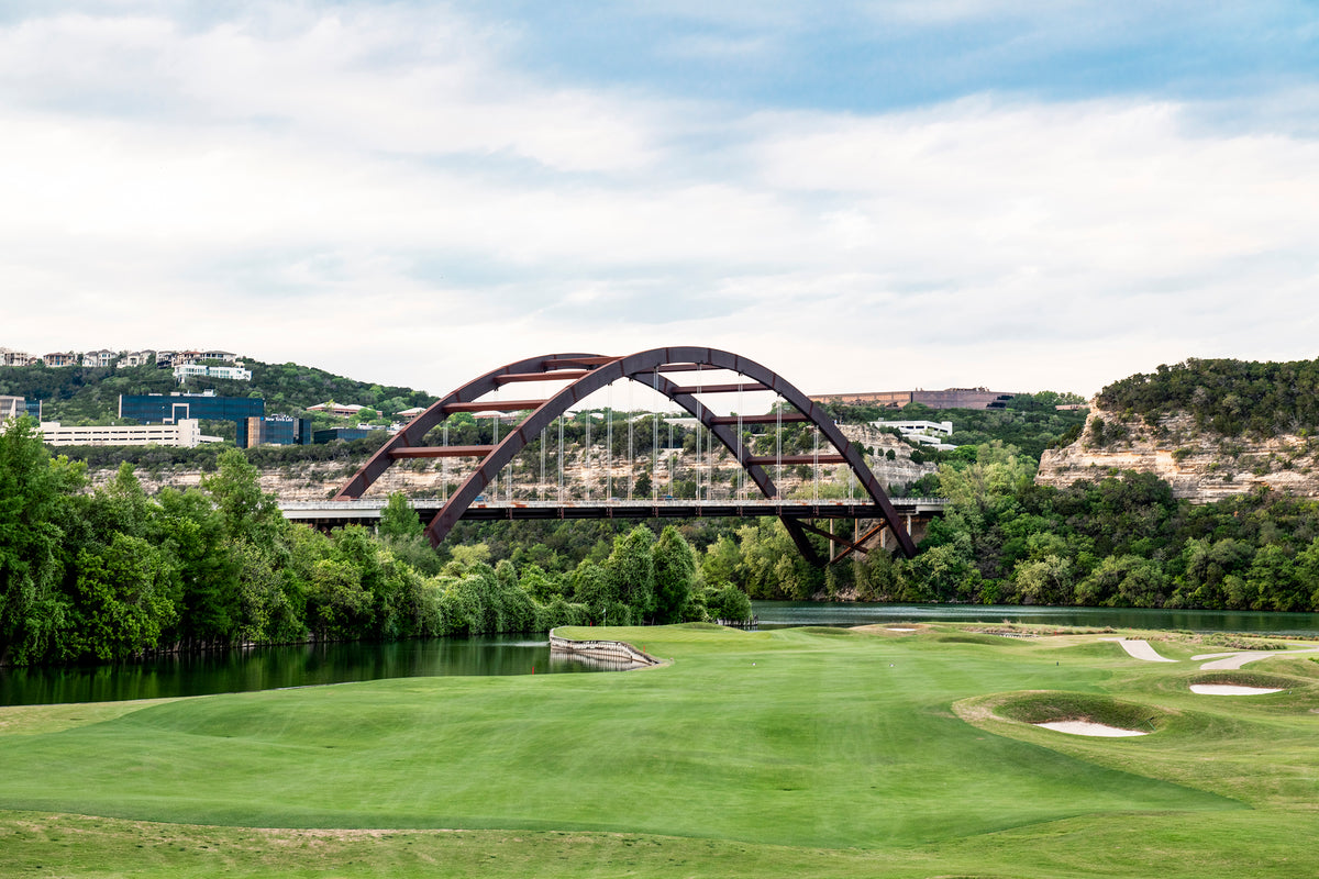 Pennybacker Bridge runs across Lake Austin with ACC Golf Course in the foreground